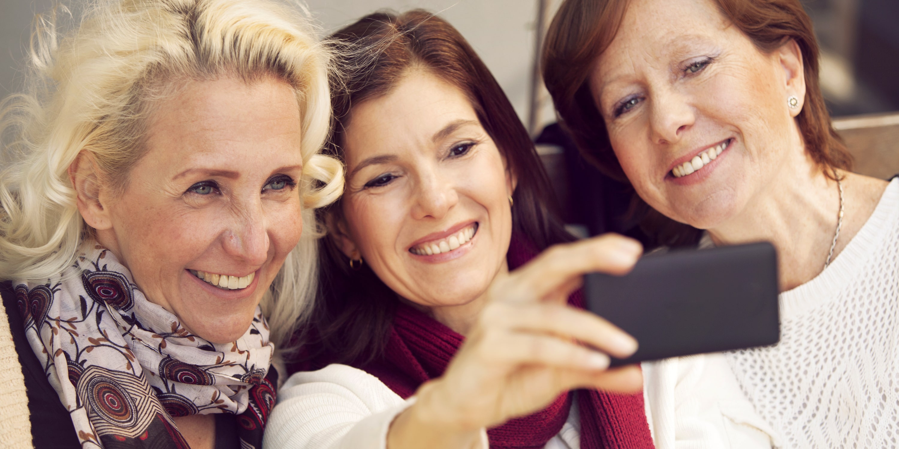 why women feature image - women taking a selfie
